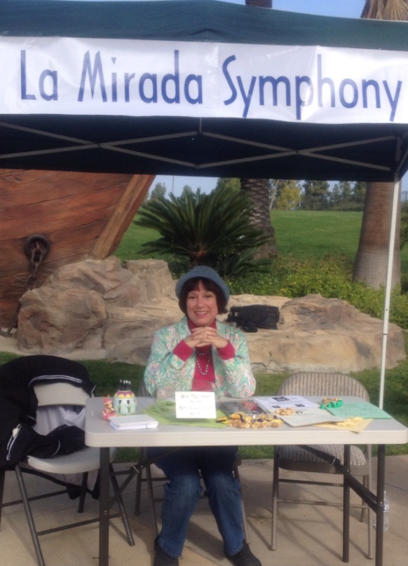 Symphony Association, Dana Taylor, at the Duck Race Booth