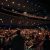 Audience seated at a free symphony concert experiencing live music together