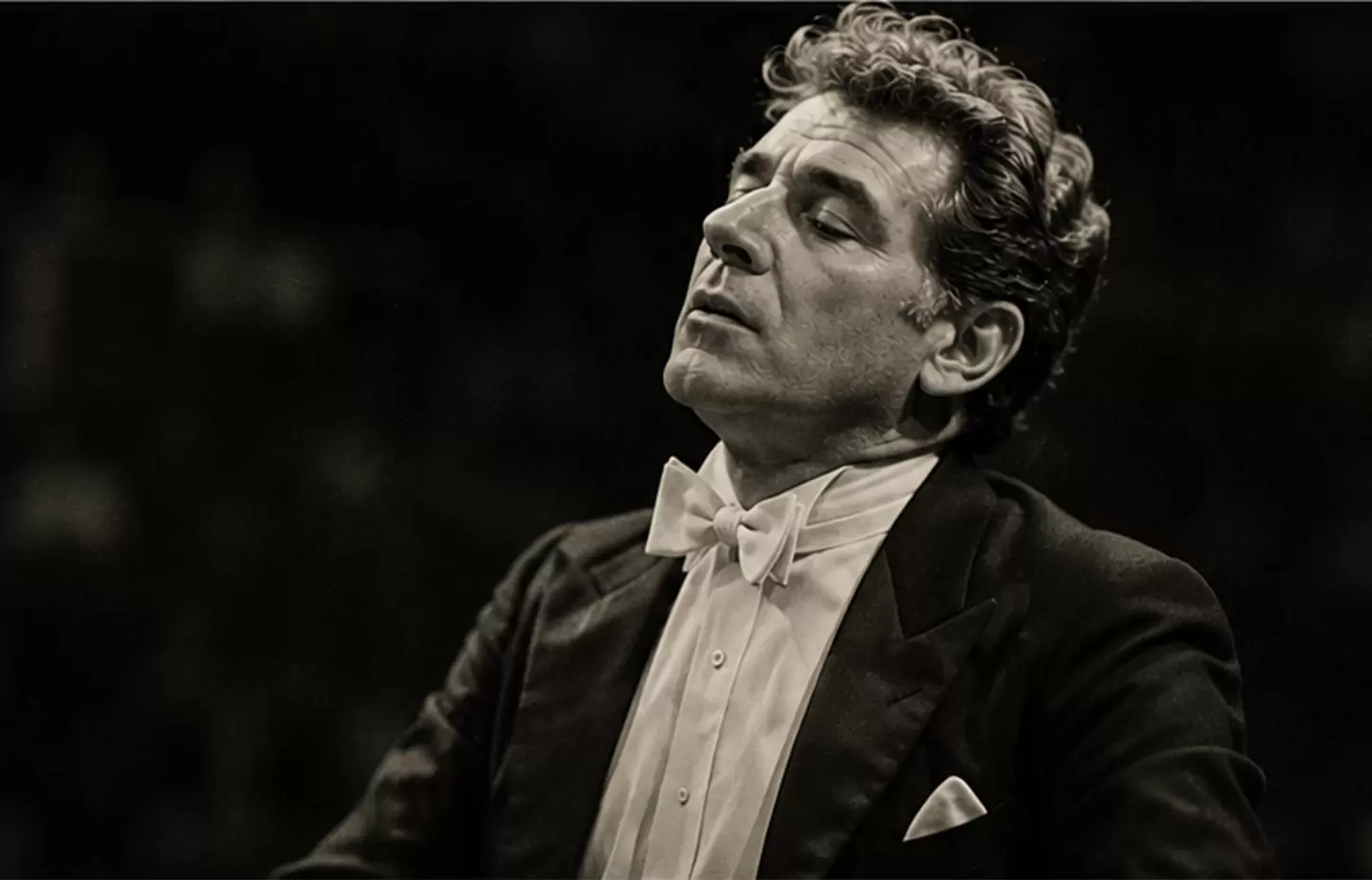 Editorial-style portrait of Leonard Bernstein conducting passionately