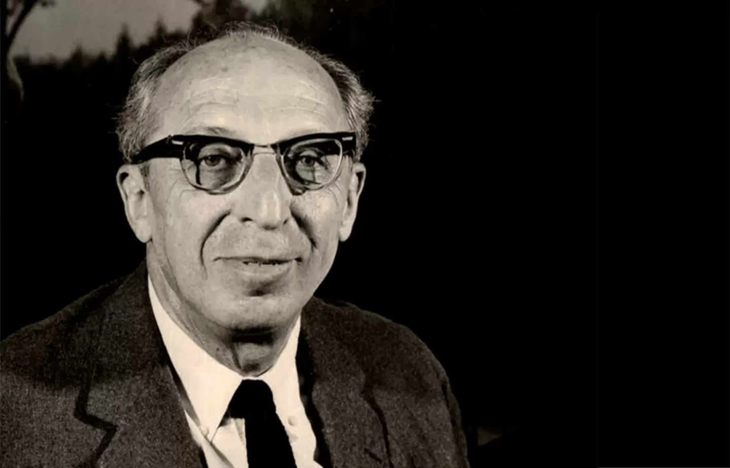 Editorial-style portrait of Aaron Copland in an American landscape
