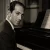 Editorial-style portrait of George Gershwin at a piano