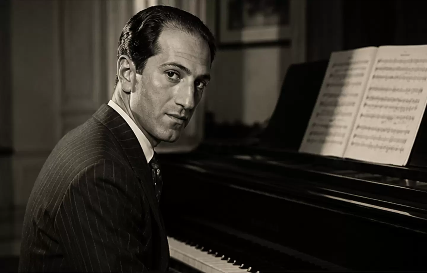 Editorial-style portrait of George Gershwin at a piano