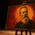 Nikolai Rimsky-Korsakov – Sketches of Spain Painted portrait of Nikolai Rimsky-Korsakov displayed on an easel on a theater stage