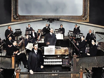 1920s movie theater orchestra performing live music during the silent film era
