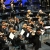 Orchestra on Stage for Capriccio Espagnol Preview Symphony orchestra performing on a concert stage as the conductor leads from the podium