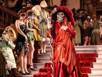 Lon Chaney as the Red Death in a crimson costume at the masquerade ball in The Phantom of the Opera (1925).